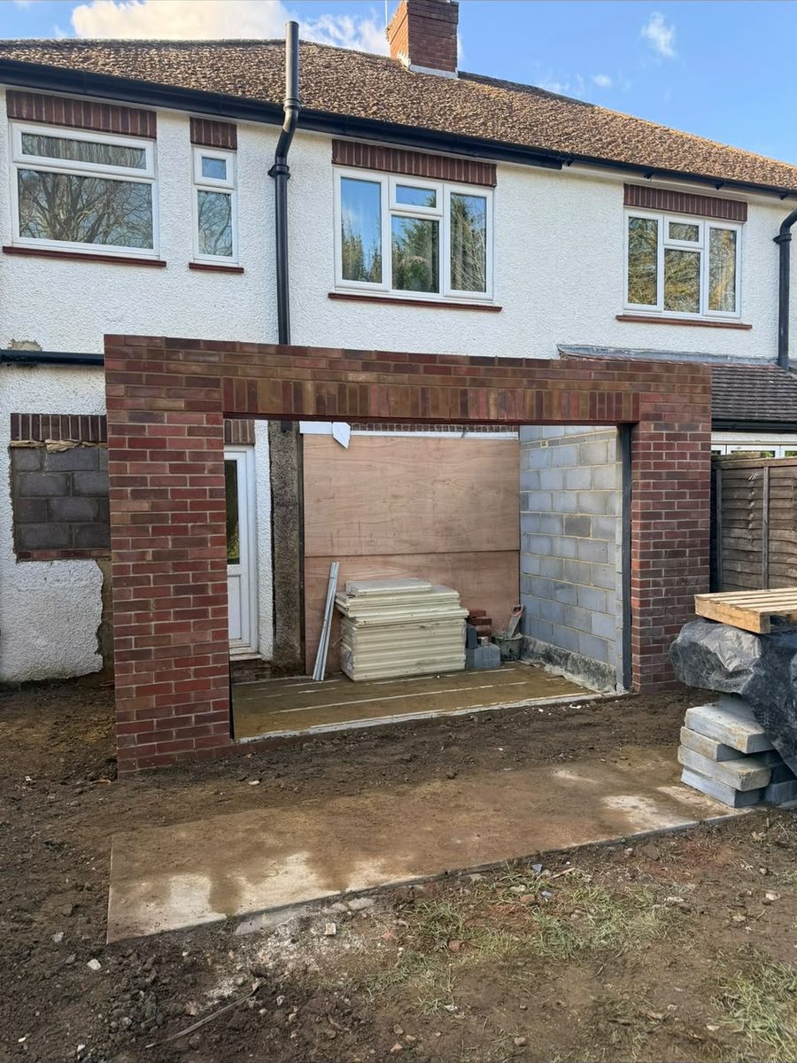 Extension brickwork with a wide bi-fold door opening formed into the rear of the house
